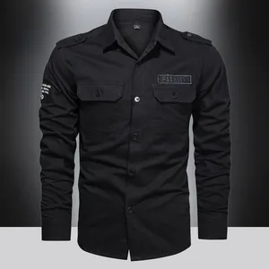 Detail of black long-sleeve cargo shirt with chest pockets and fashion patch accent