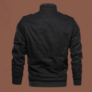 Detail view of the black cotton jacket back featuring military shoulder straps and ribbed hem