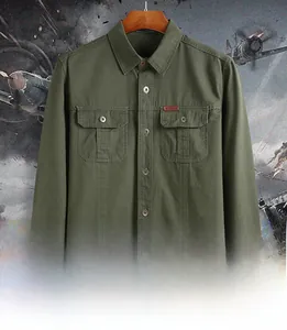 Detail of army green military style work shirt featuring double chest pockets and outdoor tag