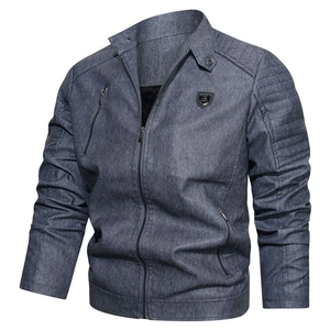 Close-up of retro blue-grey motorcycle jacket with quilted shoulders and metal zipper detail