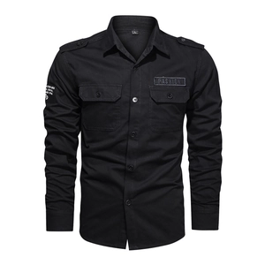Detailed view of black military cargo shirt with buttoned pockets and shoulder epaulets