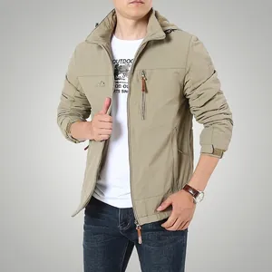 Men's khaki hooded outdoor utility jacket with windproof fabric and tactical chest pockets