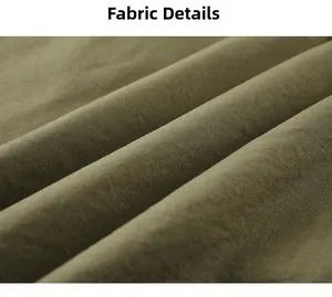 Detailed close-up of army green twill fabric showing thick texture on hooded jacket