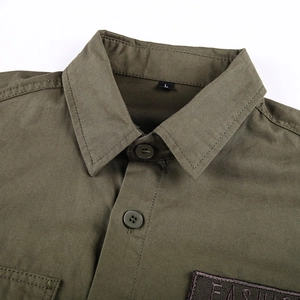 Detail of army green cotton shirt collar and chest with FASHION embroidery patch