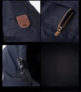 Detail view of windproof jacket showing fleece lining, zipper pocket and adjustable hood buckles