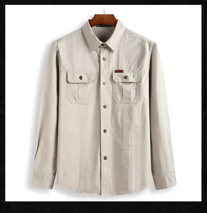 Detail of outdoor utility shirt with chest flap pockets and embroidered brand patch