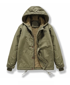Detail of army green hooded parka featuring warm fleece lining and A.R.M.Y. chest print