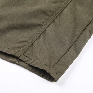 Detailed close-up of army green twill fabric showing high-quality double stitching and hem