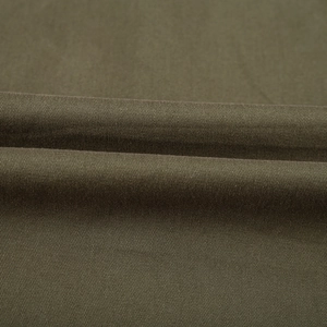 Macro shot of olive green twill fabric showing detailed texture and soft drape