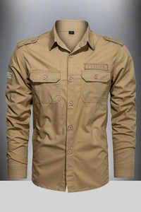 Detail view of khaki workwear shirt featuring classic collar and functional chest pockets