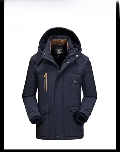 Detailed view of the dark blue padded parka jacket featuring a faux fur hood and flap pockets