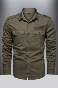Detail of army green cargo shirt showing military epaulettes and chest pockets with label