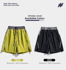 Detail of 100% polyester shorts with elastic drawstring waist and side contrast tape