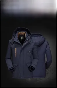 Detail of navy blue winter parka with detachable fur hood and embroidered chest pocket