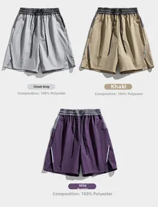 Three colors of quick-dry polyester sports shorts with elastic waist and drawstring