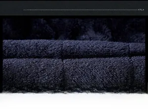 Detailed view of the soft velvet striped fabric texture for men's winter cotton coat