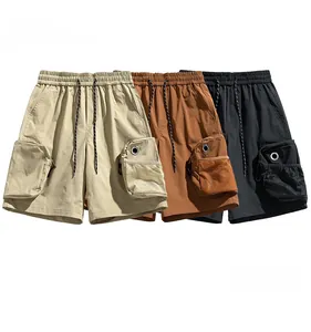 Detail of cargo shorts in khaki, brown, and black with drawstring and side utility pockets