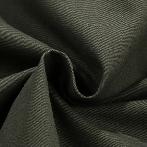 Close-up of olive green twill woven fabric for men's minimalist long sleeve work shirt