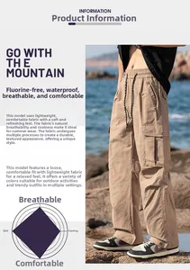 Detail of khaki outdoor cargo pants showing waterproof fabric and elastic drawstring waist