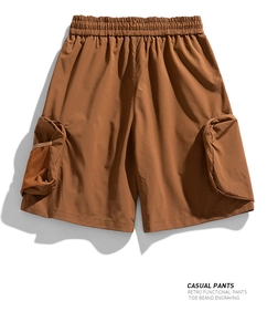 Detail of mens tactical cargo shorts featuring elastic waistband and mesh pocket design