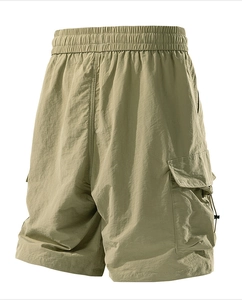 Detail of water-repellent cargo shorts featuring elastic waistband and large side pockets