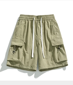 Detail view of olive green cargo shorts with elastic waist and adjustable drawstrings