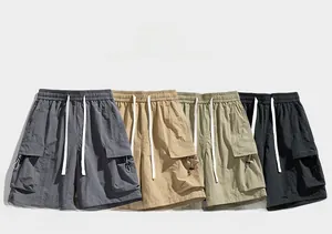 Detailed flat lay of water-resistant cargo shorts in dark gray, khaki, green, and black