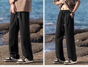 Close-up of black wide-leg casual pants with drawstring waist for outdoor camping