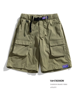 Detail of cargo shorts waist with adjustable webbing belt and tactical buckle