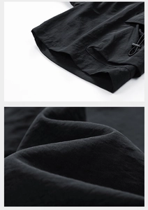 Detail of adjustable drawstring hem and high-density waterproof twill fabric texture