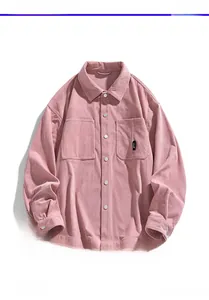 Detail view of pink corduroy shirt texture with twin pockets and button-down front
