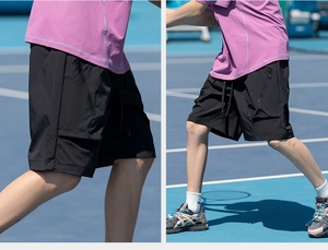 Detail of black sports shorts featuring hidden zipper pocket and athletic cut for running