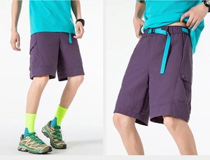 Detail of deep purple techwear shorts featuring a blue woven waist buckle and flap pocket