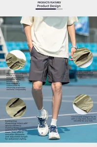 Detail view of quick-dry gray shorts with elastic waist and yellow zipper pockets