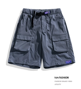 Detail of gray cargo shorts featuring elastic waist with black buckle belt and large side pockets