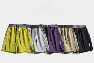 Detail view of five quick-dry athletic shorts with drawstring waist and reflective side stripes