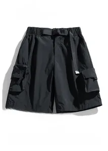 Detail of water-repellent cargo shorts with adjustable belt and 3D utility pockets