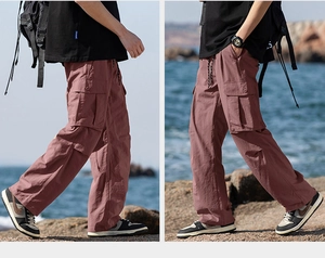 Detail of lightweight outdoor pants featuring large cargo side pockets and drawstring waist