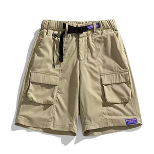 Loose fit khaki cargo shorts with nylon belt and utility pockets in urban outdoor style