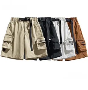 Flat lay of four water-repellent cargo shorts in khaki, black, white, and tan colors