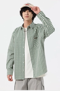 Detailed view of long-sleeve jacquard shirt with green stripes and chest pocket
