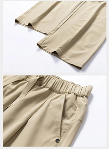 Detail of khaki hiking trousers featuring elastic waist and smooth ice silk fabric texture