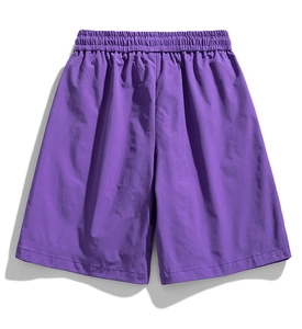 Detail view of purple water-repellent cargo shorts with elastic waistband and quick-dry texture