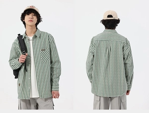 Detailed view of green and white vertical striped men's casual long sleeve shirt