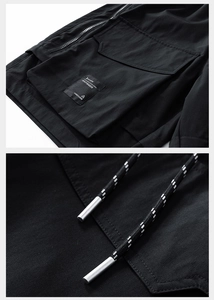 Détail de la poche cargo avec zip tactique et cordon de serrage sur le short noir