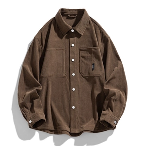Dark brown corduroy long sleeve shirt jacket with chest pockets and white buttons