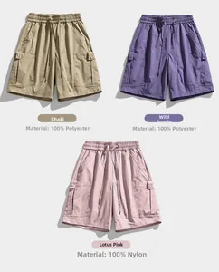 Flat lay of cargo shorts in khaki, purple and pink with elastic drawstring waistbands