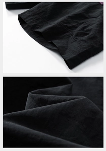 Macro shot of black ice-skin synthetic fabric texture and reinforced double-stitched hem