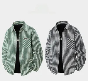 Detail view of denim jacquard long sleeve shirts with woven label and classic chest pocket