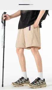 Detail view of khaki casual outdoor shorts with purple webbing belt and lightweight fabric